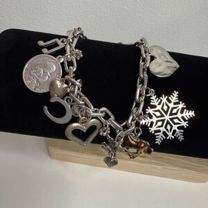 Avon Silver Toned Bracelet with various charms